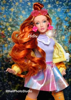 a barbie doll with long red hair and yellow boots