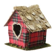 a red and black plaid birdhouse with grass roof