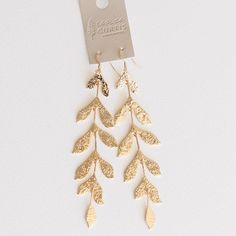 Long leaf gold earrings Gold Metal Drop Bridal Earrings, Gold Brass Bridal Earrings, Elegant Gold Leaf-shaped Jewelry, Elegant Leaf-shaped Jewelry With Matching Earrings, Elegant Leaf-shaped Earrings For Party, Elegant Leaf-shaped Jewelry For Party, Gold Wrap Drop Earrings For Wedding, Elegant Leaf-shaped Party Earrings, Gold Drop Earrings For Pierced Ears