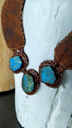 Stunning necklace handcrafted with caramel leather and Turquoise Jasper stones slabs. The leather has a beautiful texture that makes the difference and highlights the pieces. Totally stitched by hand. This necklace is gorgeous and sophisticated. **IMPORTANT TO KNOW: The piece is one of a kind, that it means, that isn't another piece like that. This is what I love to do: unique pieces for exigent women. THE BRACELET WAS SOLD!! **ABOUT THE NATURAL STONES: This jewelry was handmade with naturals ge Handmade Adjustable Southwestern Turquoise Necklace, Handmade Southwestern Adjustable Turquoise Necklace, Handmade Adjustable Brown Turquoise Necklace, Adjustable Turquoise Necklace With Patina, Handmade Rustic Adjustable Turquoise Necklace, Bohemian Brown Turquoise Necklace For Jewelry Making, Artisan Turquoise Stone Necklace, Southwestern Style Hand Tooled Necklace As Gift, Artisan Necklace With Adjustable Patina