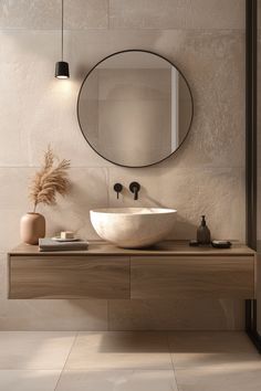 a bathroom with a sink and mirror on the wall next to a plant in a vase