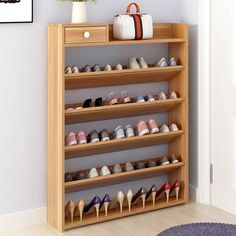 a wooden shoe rack filled with lots of shoes