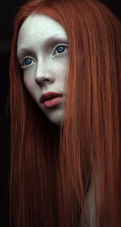 a woman with long red hair and blue eyes is shown in this artistic photo,