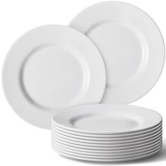 white plates stacked on top of each other in front of a white background with one empty plate