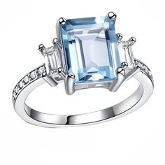 Ruthanna 9mmx7mm Emerald Cut Created Sky Blue Topaz with Clear Baguette Accent CZ Sterling Silver Engagement or Statement Ring the Ginger Lyne Collection Metal: Sterling Silver Plating: Rhodium Stone: Sky Blue Topaz + Clear Cubic Zirconia Stone Size: 9mmx7mm This piece is custom made for our collection. It is Guaranteed 100% Genuine 925 Sterling Silver with Rhodium Plating for a Shining bright non-tarnish finish. It is 925 Hallmark Stamped. Size: 10.  Color: Metal Type.  Gender: female.  Age Gro Sky Blue Topaz Engagement Ring, Blue Centerpieces, Heart Promise Rings, Blue Topaz Engagement Ring, Promise Ring Gift, Sapphire Engagement Ring Blue, Sky Blue Topaz, Silver Engagement Rings, Engagement Rings Sapphire