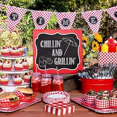 a table topped with cupcakes and cakes next to a sign that says chillin and grillin