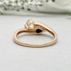 This beautiful ring is made from genuine 925 sterling silver with rose gold plating. Ring details- -The Main stones are pear shape 6mm by 4mm Natural Black Onyx And 6mm Clear Heart Simulated Diamond -Side stones are Round Clea 1.5mm simulated diamonds -Ring is casted in solid 925 sterling silver with rose gold plating (yellow gold and rhodium plated also available, please check the drop down menu for more options) -The Total face height of the ring measures 8mms and the band width measures 2mms Rose Gold Rings With Heart-cut Rose Diamonds, Rose Gold Heart Cut Rings With Rose Cut Diamonds, Rose Gold Teardrop Brilliant Cut Ring, 14k Rose Gold Pear-shaped Ring, Classic Rose Gold Heart Ring For Anniversary, Rose Gold Teardrop Ring For Anniversary, Rose Gold Teardrop Anniversary Ring, Teardrop Rose Gold Ring With Prong Setting, Rose Gold Teardrop Rings With Diamond Accents