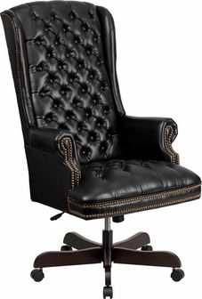 an office chair with black leather upholstered on the back and gold trimmings