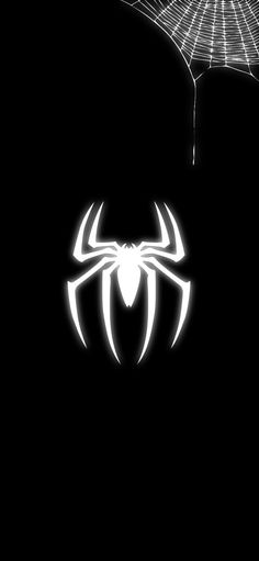 a spider - man logo is shown in the dark, with its web hanging from it's side