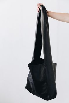 A soft form bag meant for the journey. It features a wide shoulder strap that can be tied in a variety of ways to suit the wearer. Daily Use Bags With Detachable Strap, Affordable Shoulder Bag With Detachable Strap, Lulus Black Handbag, A Perfect Circle, Dancing In The Rain, Small Wallet, Nice Leather, Fast Fashion, Leather Working