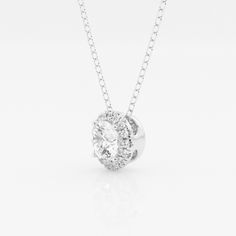 A diamond with a fine halo is better than none! This beautiful round lab grown diamond pendant is encircled with tiny shimmering smaller diamonds, to create a halo effect. Suspended by a delicate gold chain that slides through. Dazzling Diamond White Solitaire Necklace With Halo, Dazzling Solitaire Necklace With Round Pendant And Halo Setting, Dazzling Solitaire Necklace With Halo Setting, Dazzling Round Pendant Solitaire Necklace With Halo Setting, White Gold Solitaire Necklace With Halo Cubic Zirconia, Diamond White Solitaire Necklace With Halo Design, Diamond White Solitaire Necklace With Halo Setting, White Gold Cubic Zirconia Diamond Necklace With Halo, White Gold Cubic Zirconia Halo Diamond Necklace