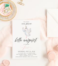 a pink and white baby shower party with confetti