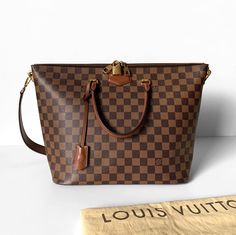 In Damier Ebene canvas and complimentary brown leather, this Louis Vuitton Belmont is in excellent condition and includes its original dust bag, clochette, lock and keys. Lock And Key, Louis Vuitton Damier, Brown Leather, Dust Bag