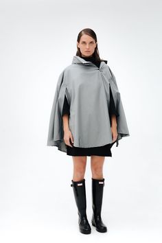 Pluvo's Rain Capes are functional and a unisex design with an elegant fit, they are perfect for every day, going around town, camping, going to concerts or riding your bike. Rain Capes are made from a waterproof lightweight fabric, they will save you from the rain and bring you home safe and sound. When riding your bike, you can adjust your cape with its front rubber bands and, if you're walking, you can keep your cape from flying away by using the ones on the zippers. DETAILS: - Adjustable hood that can be stored in pocket - Inner pocket - Front zipper - Reflective on neck and logo - Grip rubbers for riding bike - Includes small storage bag - 100% polyester TECHNOLOGY:  - Waterproof technologies Laftech: Laftech is the technological seal of Lafayette Sports developed by scientists who see Oversized Waterproof Outerwear For Fall, Oversized Raincoat For Rainy Fall Weather, Gray Oversized Cape Outerwear, Oversized Gray Cape Outerwear, Oversized Outdoor Cape Poncho, Oversized Cape Poncho For Outdoor, Outdoor Poncho With Cape Shape, Oversized Waterproof Winter Outerwear, Oversized Weatherproof Raincoat For Fall