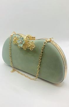 Stunning Sage Green Flower Embellished Bridal Wedding Clutch Bag with Gold Chain  Soft Velvet Style Finish Simply Beautiful Wedding Clutch Bag with Two Gold Chains, One for Short and One for the Shoulder  Very Elegant Perfect Wedding Day Clutch Bag  Co-ordinating Shoes Also Available  Size Approx. 22.5cm x 11.5cm x 4cm Flower-shaped Evening Clutch, Elegant Green Clutch, Elegant Flower-shaped Evening Bag, Elegant Flower Clutch For Party, Elegant Flower Shaped Clutch For Formal Occasions, Elegant Flower-shaped Evening Bag For Events, Elegant Flower Shaped Evening Bag For Events, Elegant Flower Shaped Evening Bag, Luxury Wedding Evening Bag With Chain Strap