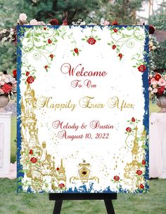 a welcome sign is displayed in front of flowers and greenery at a wedding ceremony