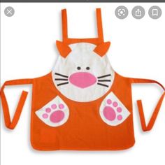 an orange apron with a cat design on it