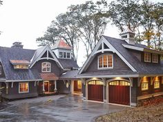 a house with two garages and three windows