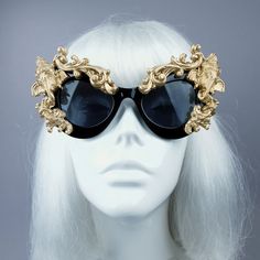 Hand-decorated black & gold filigree ornate sunglasses featuring Ganesh. Please note: There is no ready-made sunglasses box large enough for these sunglasses. These sunglasses are wearable art and need to be treated with due care. While i have taken every possible care to make them sturdy throwing them in a bag careless may damage them. Treat them as you would a precious thing... Approx measurements: Inner arm to arm: 13cm Total width: 16cm Approx Weight: 42g Thank you in advance for not PM' Elegant Gold Cat Eye Sunglasses For Evening, Luxury Gold Cat Eye Sunglasses For Party, Gold Mirrored Sunglasses For Party, Gold Mirrored Lenses Sunglasses For Party, Gold Cat Eye Sunglasses With Mirrored Lenses For Party, Gold Mirrored Cat Eye Sunglasses For Party, Gold Mirrored Lenses Cat Eye Sunglasses For Party, Gold Tinted Sunglasses For Festival, Luxury Gold Cat Eye Sunglasses For Evening