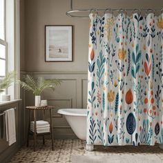 a bathroom with a bathtub, shower curtain and rug on the floor in front of it