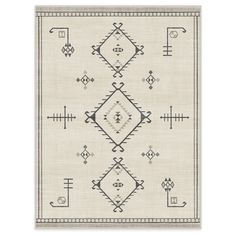 a beige rug with black and white designs on it