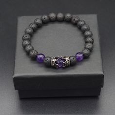 Materials Natural Amethyst &Lava beads  Cubic Zirconia Crown charm BRACELET SIZE - WRIST SIZE: Please select your actual "wrist size" (not the size you think the bracelet should be) in the dropdown menu and I will make sure the bracelet fits your wrist. Your wrist size is the actual wrist measurement in the location where you will be wearing your bracelet. The measurement is in inches. How to Measure: Measure your wrist with a tape measure or a piece of string. Add ¼ inch for a snug fit or Add ½ Amethyst Bracelet Beads, Crown Charm, Bracelets Design, Purple Bracelet, Lava Beads, Beads Bracelet Design, Gemstone Beaded Bracelets, Mens Beaded Bracelets, Lava Bead