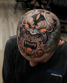 a man with a tattoo on his head