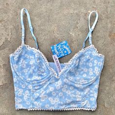 Features: All Over Mini Floral Print On A Baby Light Blue And White Colorway Underwired Cups (No Padding), Adjustable Straps. Scalloped Edges Add To The Overall Vibe Brand New With Tags Still On. Rrp $48. Tagged Size Xs. Summer Light Blue Bra-friendly Top, Blue Summer Bra With Built-in Support, Blue Summer Bra For Vacation, Summer Light Blue Bra With Built-in Bra, Summer Light Blue Bra With Built-in Support, Blue Fitted Tops With Underwire Support, Blue Summer Vacation Bra, Summer Cotton Bra For Beach, Summer Beach Bra In Cotton