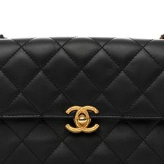 This is an authentic CHANEL Lambskin Quilted Small Chain Flap in Black. This petite shoulder bag is crafted of diamond-quilted lambskin leather in black. The bag features a leather-threaded aged gold chain top handle and shoulder strap and a textured aged gold Chanel CC turn-lock. This opens to a pink fabric interior with a zipper pocket. Chain Top, Gold Chanel, Leather Thread, Pink Fabric, Lambskin Leather, Gold Chain, Top Handle, Gold Chains, Zipper Pocket