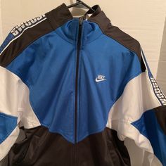 Nike Vintage Jacket ! Size Small! Blue Blue Sportswear Outerwear For Spring, Casual Blue Track Jacket For Streetwear, Blue Spring Sportswear Outerwear, Navy Track Jacket For Spring Streetwear, Blue Hooded Windbreaker For Streetwear, Blue Sportswear Windbreaker For Winter, Blue Sports Windbreaker For Spring, Blue Hooded Track Jacket For Streetwear, Blue Windbreaker For Fall Streetwear