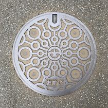 a manhole cover is shown on the ground