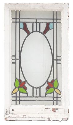 an old stained glass window with flowers and leaves in the center, on white background