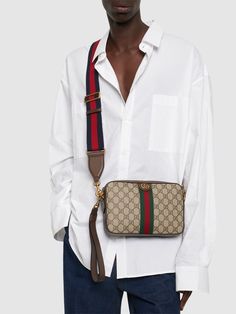 Height: 16cm Width: 23.5cm Depth: 4.5cm. Weight: 680g. Strap drop: 57cm. Adjustable strap. Top zip closure. Logo details. All over pattern placement may vary. Leather trim. Lined Gucci Ophidia, All Over Pattern, Sport Swimwear, Sports Sweatshirts, Crossbody Messenger Bag, Strap Top, Sports Brands, Swim Accessories, Shearling Jacket