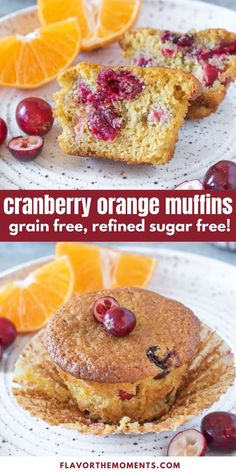 cranberry orange muffins on a white plate with orange slices and cherries