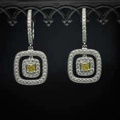 Double Halo Earrings with Rare Natural Fancy Yellow Princess-Cut Center Diamond & White Diamond Accents in 18K White Gold - FlawlessCarat Elegant Yellow Earrings With Halo Design, Elegant Yellow Diamond Earrings With Halo Design, Elegant Yellow Diamond Earrings With Diamond Accents, Yellow Gold Sterling Silver Halo Diamond Earrings, Luxury Yellow Diamond Cut Earrings, Double Halo, Halo Earrings, Gold Jewellery Design, Yellow Diamond