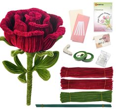 the flowers are being made with yarn and other crafting supplies such as ribbon, scissors, tape, thread