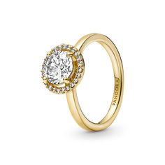 Classic yet modern, the 14k gold-plated Sparkling Round Halo Ring features a round center stone encircled by a halo of brilliant-cut clear cubic zirconia pavé. The Pandora logo is engraved on the inside of the shank. A timeless gift for an elegant Mom. Round Halo Ring, Pandora Logo, Round Halo, Pandora Rings, Gold Plated Rings, Classic Ring, Halo Ring, Halo Rings, Pandora Jewelry