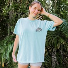 "Looking for a Cute Dolphin shirt as a gift for an Ocean Lover? Or perhaps just a fabulous Mom and Baby Dolphin Shirt to add to your own collection? This hand drawn original design \"Embroidered Dolphins\" Comfort Colors T Shirt is the perfect addition to your closet of trendy Ocean Shirts. Embroidered on comfort colors shirts which are not only super soft with beautiful coloration, but give the perfect vintage feel to this Bottlenose Dolphin design tee. This Dolphin Lover Shirt is part of my \"Ocean Creature Shirts\" collection.  T-SHIRT DETAILS: Comfort Colors 1717 Crewneck T-Shirt * 100% ring-spun cotton * This Shirt is considered a \"HEAVYWEIGHT\" tee but is SUPER soft and flexible * (^ For reference this shirt is going to be thicker than the Bella + Canvas 3001) * Garment-dyed for abs Ocean Shirts, Dolphin Shirt, Baby Dolphin, Dolphin Design, Cute Dolphin, Baby Dolphins, Ocean Shirt, Dolphin Lover, Elephant Shirt