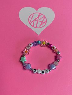 Thank you for visiting my shop 🫶🏼 This listing is for an elastic Stray Kids bracelet with a 3 inch limited edition decal (shown). Right now I only have listed what's in stock.  If there is another bias you would like, please send me a message.  I will also be making these in several colors in one.  Question?  Please contact me before ordering.  Made in a smoke free home.  ~blue Trendy Stretch Bracelet With Letter Print, Trendy Pink Beaded Bracelets With Letter Print, Pink Personalized Novelty Stretch Bracelet, Personalized Pink Novelty Stretch Bracelet, Trendy Pink Bracelets With Letter Print, Trendy Pink Letter Print Bracelets, Trendy Personalized Purple Stretch Bracelet, Trendy Handmade Stretch Bracelet For Valentine's, Casual Customized Stretch Bracelet For Birthdays