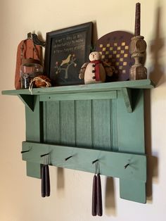 a shelf that has some items on top of it and is hanging from the wall