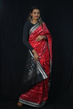 Exclusive hand-woven Sambalpuri silk saree with tribals. Finest pure handwoven sambalpuri ikat silk saree with traditional motifs woven by the master weavers of Sambalpur, Odisha. It has lovely patterns and is world-famous for its stunning colours, texture and designs. Occasion: Party Wear Fabric: Sambalpuri Primary Color: Red Secondary Color: Black Material: Mulberry Silk/ Sambalpuri Silk Pattern: Motif Border Type: Ikat Border Size: Medium Blouse Piece: Included Care: Dry Clean Disclaimer : This is a genuine handwoven piece, unevenness in the selvedge and weave could be expected and colours may fade or bleed due to the traditional dyeing method employed. Black Pre-draped Saree With Traditional Patterns, Black Bollywood Handloom Pre-draped Saree, Black Silk Handloom Pre-draped Saree, Black Pre-draped Saree With Zari Weaving For Puja, Black Tussar Silk Dupatta For Navratri, Black Handloom Pre-draped Saree For Festivals, Black Art Silk Pre-draped Saree For Festivals, Black Paithani Silk Handloom Dupatta, Black Handloom Paithani Silk Dupatta