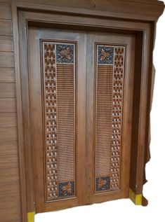 a wooden door with intricate carvings on the front and side panels, made from wood