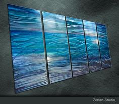 an abstract painting with blue and white waves in the ocean, on a black background