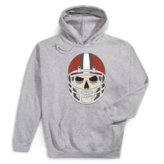 Elevate your football game with our Game Face hooded sweatshirt! Featuring a fierce skeleton head with a helmet, this hoodie blends unbeatable comfort with standout style, making it perfect for the field and even better for Halloween. Made from a cozy mix of cotton and moisture-wicking polyester, it's ideal for any activity. The double-lined hood provides extra warmth and protection, while the front pouch pocket keeps your hands cozy. Personalize the back with your team number to add a unique touch. It's a must-have for football players who love a touch of spooky style! Football Spirit, Polo Quarter Zip, Hockey Bag, Skeleton Head, Game Face, Polo Long Sleeve, School Tops, Halloween Hoodie, A Football