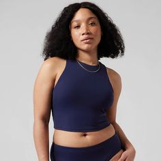 Athleta Conscious Crop Bikini Top A-C New With Tag Color: Dress Blue For: Swim, Surf, Stand-Up Paddleboard, And All Water Sports Feel: Recycled Heco Fabric Is Smooth And Sleek With Powerful Stretch Fave: Crop Silhouette Keeps You Breezy During Your Practice #530870 80% Recycled Nylon/20% Lycra Spandex Lycra Xtra Life Spandex: Long-Lasting Lycra Xtra Life Fabric Stretches And Moves With Her Recycled Heco Fabric Is Smooth And Sleek With Powerful Stretch Machine Wash And Line Dry. Imported. Medium Sporty Tankini With Built-in Bra For Pool, Fitted Blue Swim Skirt With Built-in Bra, Sporty Stretch Blue Swim Skirt, Blue Stretch Swim Skirt For Sports, Blue Swim Skirt For Sports, Blue Sports Swim Skirt, Sleeveless Athleisure Swimwear For Swimming, Blue Sleeveless Tankini With Built-in Bra, Blue Moisture-wicking Swim Skirt For Sports