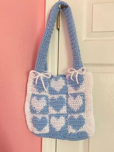 A cute tote bag to hold your things. Trendy White Crochet Shopping Bag, Trendy Blue Crochet Tote Bag, White Crochet Tote Bag For Shopping, Cute Everyday Crochet Rectangular Bag, Casual White Crochet Bag With Double Handle, Trendy Handmade Blue Bags, Casual White Square Crochet Bag, Cute Rectangular Crochet Bag For Vacation, Handmade White Crochet Bucket Bag