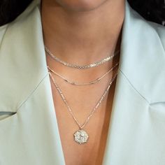 This necklace features a Sterling Silver coin pendant on a Figaro chain. Layer with necklaces from our Patented O collection. Pendant Diameter 0.6in (1.5cm) Figaro chain, 2mm Adjustable chain: 17-19in (44-48cm) When layered, chain length is: 17-21in (44-53cm) Learn more Sterling Silver Spring clasp closure Hypoallergenic, lead and nickel free #290S Layer Necklaces, Jewelry Gift Guide, Layered Chain, Moms Bracelet, Choker Pendant, Studded Necklace, Gold Statement Ring, Nose Jewelry, Figaro Chain