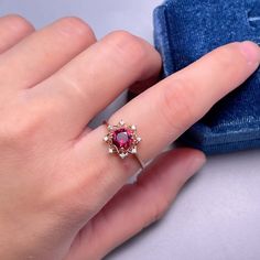 925 Sterling Silver Ring, Natural Garnet Red Stone Halo Ring, Ring for Women, Birthstone Ring for Women, Dainty Stackable Ring, Gift for Her. BASIC INFORMATION Gemstone: Natural Garnet Raw Stone Size: Round 6mm Dainty CZ Diamond (shining zircon). Side stones: Shining CZ diamond (cubic zircon). Band color: Silver--18K white gold plated sterling silver Rose Gold--18K rose gold plated sterling silver Gold -- 18K yellow gold plated sterling silver CUSTOM METALS Ring Size: From US #2 to US #15. Suppl Red Open Flower Ring, Red Cubic Zirconia Cluster Ring As A Gift, Fine Jewelry Ruby Ring In Burgundy For Gift, Ruby Gemstone Flower Ring Gift, Fine Jewelry Burgundy Ruby Ring Gift, Rose Gold Ruby Cluster Ring With Gemstones, Rose Gold Ruby Ring With Lab-created Gemstone, Red Cluster Ring Gift, Rose Gold Garnet Rings For Gift