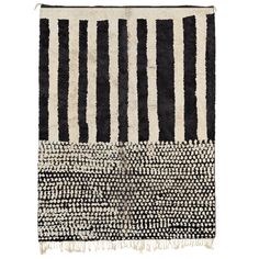 a black and white rug with stripes on it