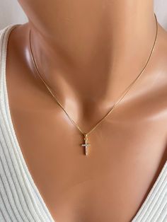 This is a dainty 14 karat gold filled cross charm necklace for women or girls. This very small cute cross features pave crystals measures 15x9mm and comes on a .08mm fine shiny box chain. Necklace is a completely 14 karat gold chain has a spring clasp in back. Model has a very small neck is wearing a 16 inch length. You have the option of 16, 18 or 20 inch length. If you order a 20 inch length, you'll receive at adjustable 18 to 20 inch chain. Comes in a cute gift box ready to present. Gold Cross Necklace For Women, Cross Necklace For Women, French Pedicure, Cross Charm Necklace, Gold Cross Necklace, Cute Gift Boxes, Neck Chain, Charm Pendant Necklace, Gold Cross